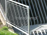 mesh panel fitted into handrail system by river 