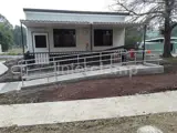 DDA disability ramp access for wheelchair users outside shop front